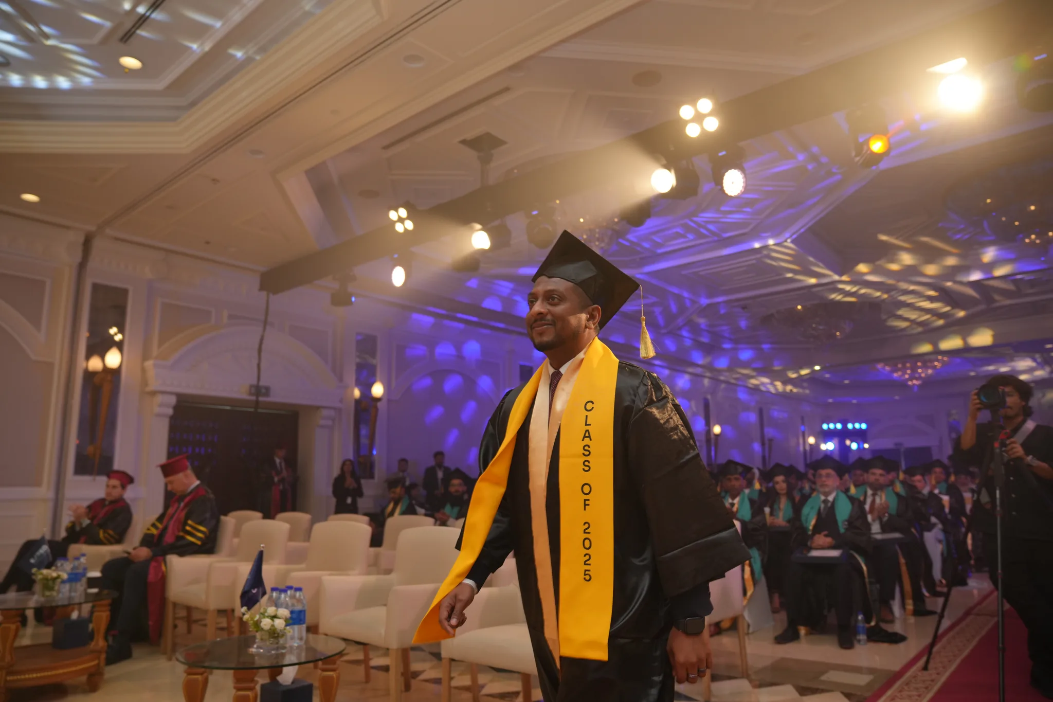 Airtics Graduation 2026: graduate walking into the Airtics convocation hall